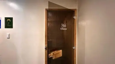 a door with a sign that says super game on it at AdahkuMaya Luxury Suites in Manila