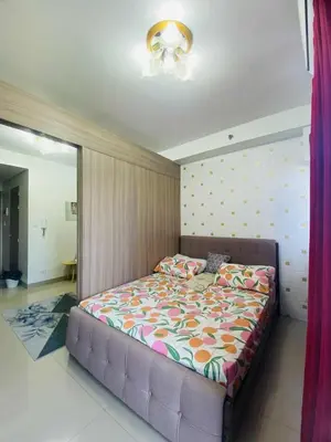 a bedroom with a bed in a room at LiCa Place 2 in Manila