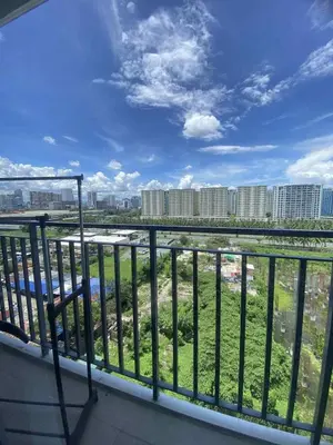 a balcony with a view of a city at LiCa Place 2 in Manila