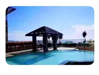 a swimming pool with a gazebo on a balcony at UrbanhavenCozyFamilybedroom in Manila