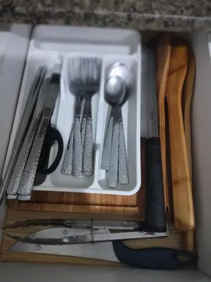 a drawer with some kitchen utensils in it at Bb Drew Rooms Near Airports in Manila