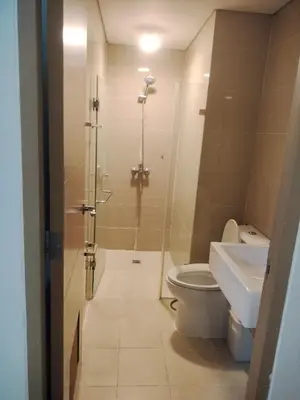 a bathroom with a shower and a toilet and a sink at Bb Drew Rooms Near Airports in Manila