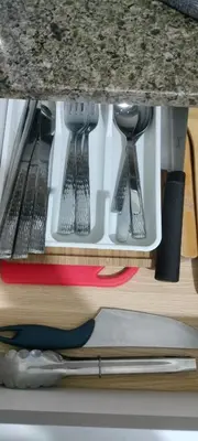 a drawer under a kitchen counter with utensils at Rqui Rooms Near Airport in Manila