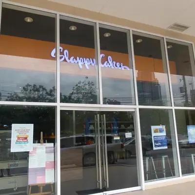 a store front with a sign on the window at Fully Furnished 1BR Condo at Jazz Residences in Manila