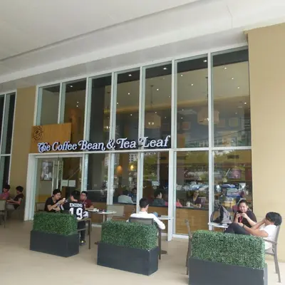 a group of people sitting outside of a restaurant at Fully Furnished 1BR Condo at Jazz Residences in Manila