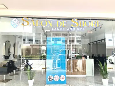 a store with a sign on the front of it at Elegant yet Affordable condo in Pasay in Manila