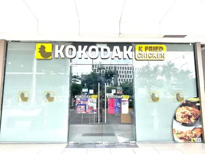 a pizza shop with a sign on the front of it at Elegant yet Affordable condo in Pasay in Manila