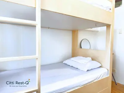 a bunk bed in a small room with a white bed at Studio City Alabang Pool Access Free for 2 Wifi & Netflix SC4 in Manila