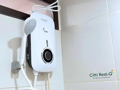 a hair dryer hanging on a wall in a bathroom at Studio City Alabang Pool Access Free for 2 Wifi & Netflix SC4 in Manila