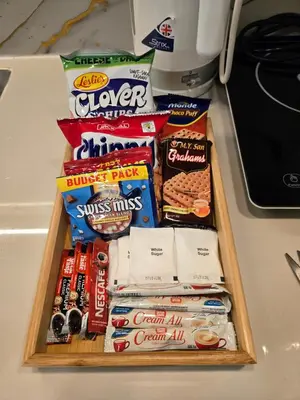 a tray filled with different types of snacks on a counter at Cozy place near pavilion mall and Sm starosa in Biñan