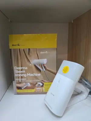 a nintendo wii game controller next to a box at Cozy place near pavilion mall and Sm starosa in Biñan