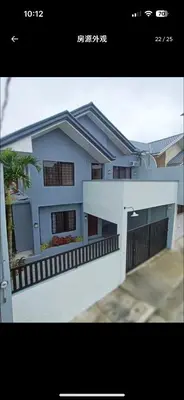 a picture of a house with a white fence at Casa Delantera Karaoke Games Pet Friendly in Manila