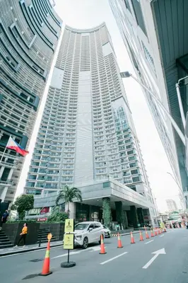 a large building with orange cones in front of it at Native studio hideaway in the heart of Poblacion, Makati in Manila