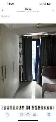 a picture of a bedroom with a bed and a window at Stayscape Ph in Manila