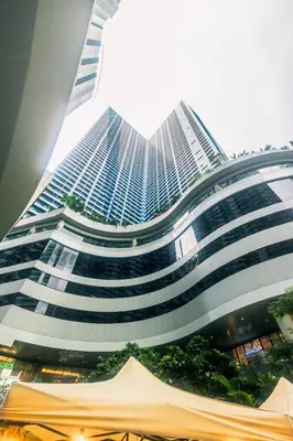 a large building with a lot of windows at The Zen Escape 1BR Makati swim gym park cook 300MB 5940 in Manila
