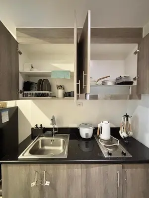 a kitchen with a sink and a counter top at Fame Residences 1br unit by LaBelle in Manila