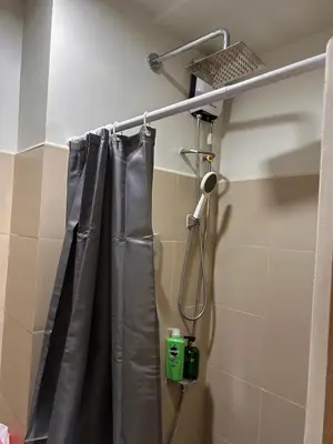 a shower curtain in a bathroom with at 1Bedroom Condo at Shore Near Airport & MOA Balcony Pool View in Manila