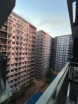 an aerial view of a large apartment building at 1Bedroom Condo at Shore Near Airport & MOA Balcony Pool View in Manila