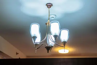 a chandelier is hanging from a ceiling at Makati Bliss Designer Stay Pool gym park Net300 makati 1767 in Manila