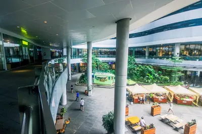 arium of a building with people walking in it at Metro Paradise 1BR Comfort Makati swim gym park 300MB 2320 in Manila