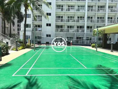 a tennis court in front of a building at Your Own Space Staycation in MOA in Manila