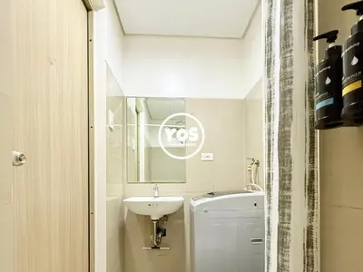 a small bathroom with a sink and a toilet at Your Own Space Staycation in MOA in Manila