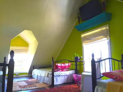 a bedroom with two bunk beds and a window at Madie's Place B&B with Private Pool in Santa Rosa near Enchanted Kingdom in Santa Rosa