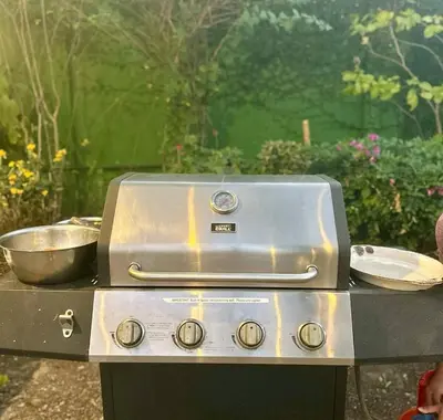 a grill with two pans on top of it at Madie's Place B&B with Private Pool in Santa Rosa near Enchanted Kingdom in Santa Rosa