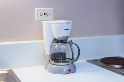 a blender sitting on top of a kitchen counter at Modern One BR Makati Condo Swim Gym Parking Netflix Fast 2428 in Manila
