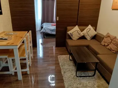 a living room with a couch and a table at Suite Escape Luxe 1BR Makati condo Getaway Gym Swim Swim 2946 Fast MB in Manila
