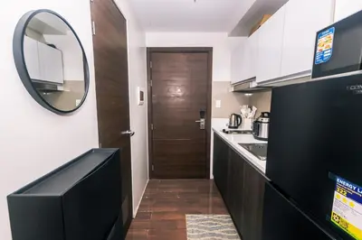 a kitchen with a mirror and a sink and a counter at Suite Escape Luxe 1BR Makati condo Getaway Gym Swim Swim 2946 Fast MB in Manila