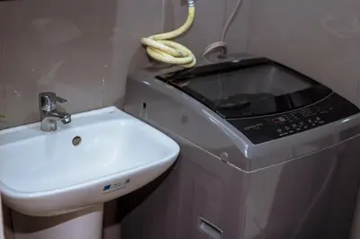 a bathroom with a sink and a toaster oven at The Kings Condo Luxury 1BR Makati Ayala Gym Swim Parking Fast Internet 3058 in Manila