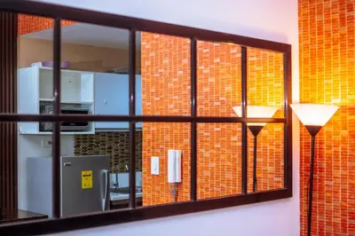a window in a room with a brick wall at The Kings Condo Luxury 1BR Makati Ayala Gym Swim Parking Fast Internet 3058 in Manila