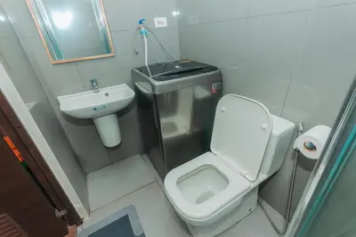 a small bathroom with a toilet and a sink at Urban Luxe 1BR Makati central gym swim Park Fast Internet MB 3301 in Manila