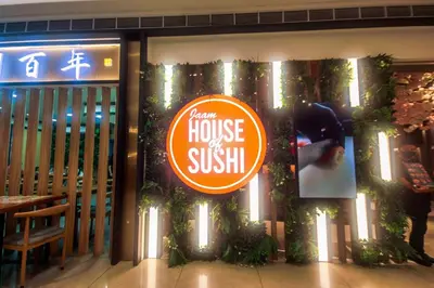 a sign on the window of a house of sushi at City Best Designer 1BR Makati Fast internet Gym Swim Park 2050 in Manila