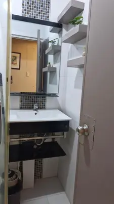 a bathroom with a sink and a mirror at MEZZA TOWER 2 SMARTTV 43inch in Manila