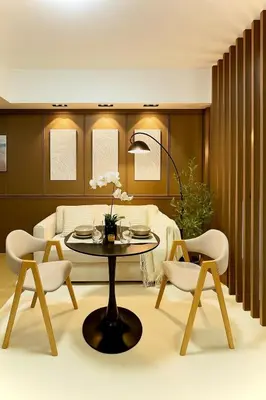 a living room with a table and chairs at Condo Venice Luxury Residences Grand canal View in Manila