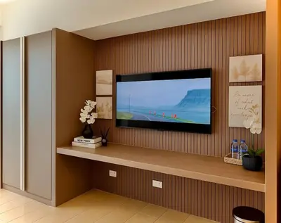 a flat screen tv sitting on top of a wall at Condo Venice Luxury Residences Grand canal View in Manila