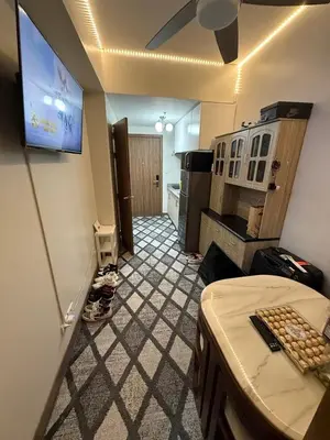 a view of a room with a kitchen and a room with at Fred Erick Staycation in Manila