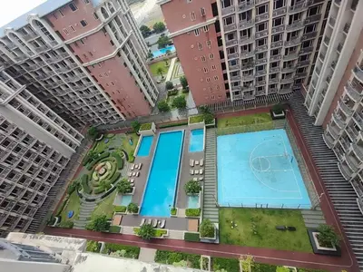an overhead view of a building with a swimming pool at Facing Pool w Balcony MOA BP1741 in Manila