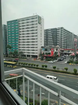 a view of a city with tall buildings and a street at 503-1queen bed 1-pull out 1-sofa bed 1- extra matressedsa view in Manila