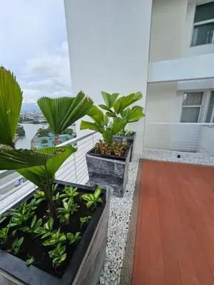a balcony with plants on the side of a building at Suntrus,t Solana Condominium - Ermita, Manila - SM Manila in Manila