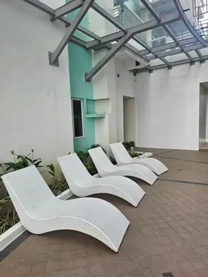a row of white chairs in a building at Suntrus,t Solana Condominium - Ermita, Manila - SM Manila in Manila