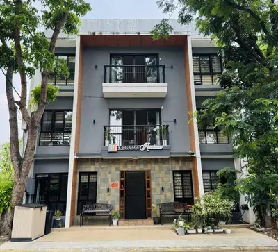 an apartment building with a door and a balcony at OYO 1157 Kegama Residences 1 in Cavite