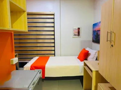 a small room with a bed and a window at OYO 1157 Kegama Residences 1 in Cavite