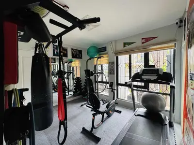 a fitness room with a gym with exercise equipment at OYO 1157 Kegama Residences 1 in Cavite