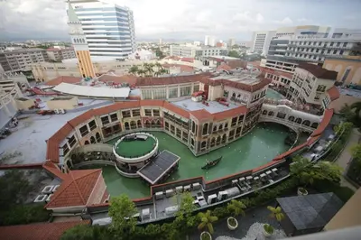 an aerial view of a large building in a city at Venice Grand Canal View Condo in Manila