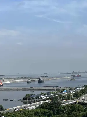 a view of a harbor with boats in the water at Cozy 2 Beds Near Mall of Asia in Manila