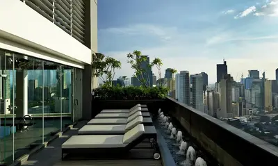 a building balcony with a view of the city at The Gramercy Residences in Manila