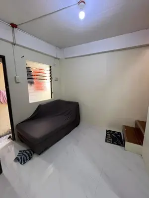 a small room with a bed in the corner at Studio Condominium by Koteniko in Manila